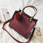 Suede Leather handbag with fur ball